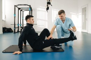 physiotherapist helping patient rehabilitation